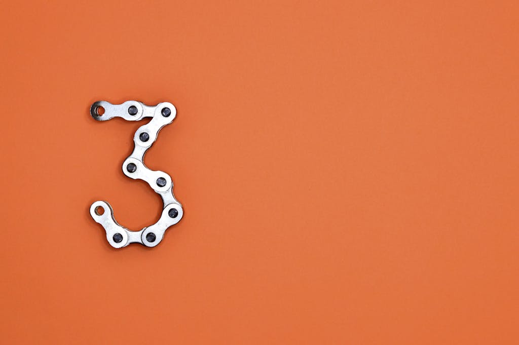 The number three against a vibrant orange backdrop
